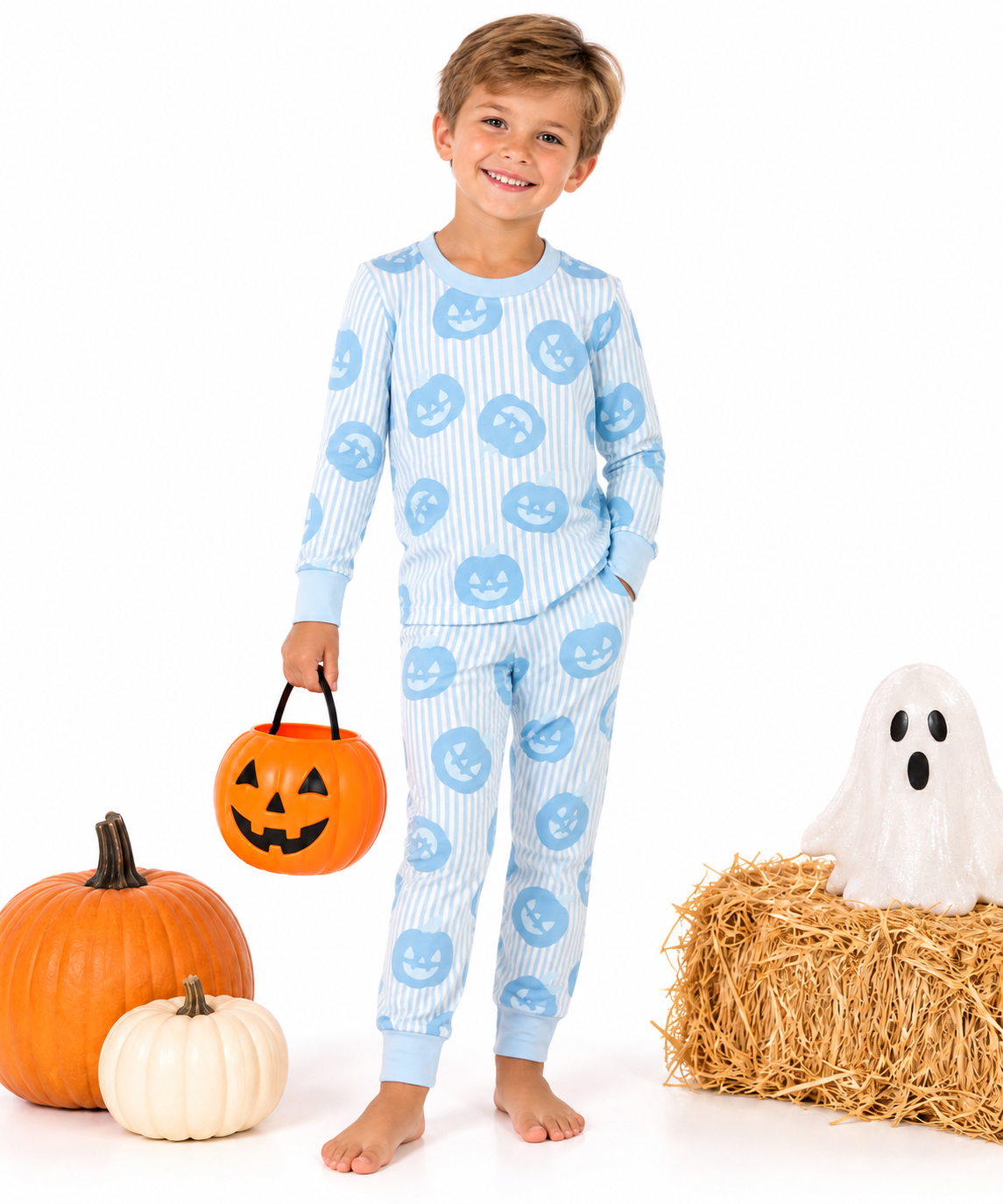 boy in blue pumpkin pjs