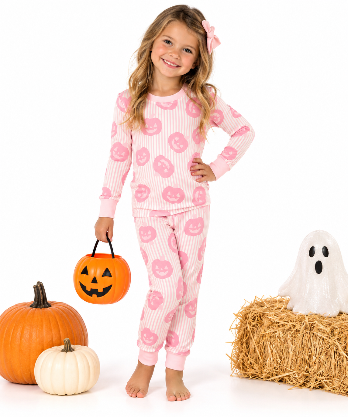 girl in pink pumpkin pjs